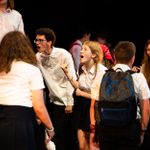 'Tuesday' by Alison Carr, performed by Plough Youth Theatre. Young people in a group, wearing white shirts, shouting at each other.