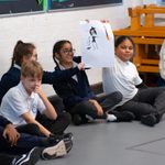 Young people showing their drawing of a Witch during The Witches schools workshop