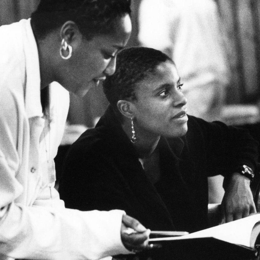The writer Winsome Pinnock during rehearsals for her play, Leave Taking, in 1995 - holding a hot drink whilst someone points a pencil at a script
