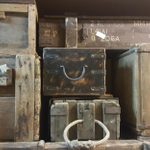 Assorted wooden cases for luggage and storage.